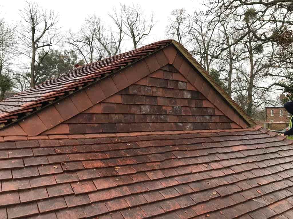 This is a photo of roof gable end that has been re-tiled in Hawkhurst, Kent. Works carried out by Hawkhurst Roofing